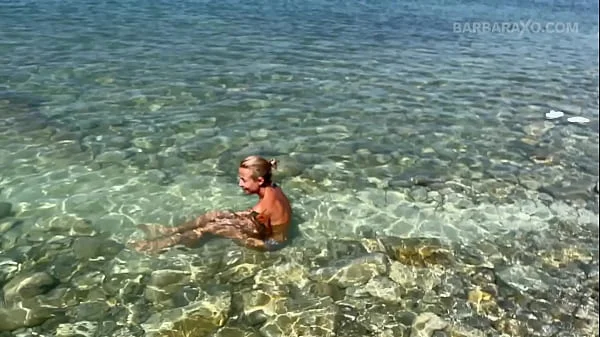 Slender tanned blonde gets fucked on the beach by the sound of waves during a photo shoot