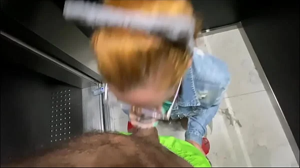 I lowered the redheaded neighbor's pants inside the elevator and put the dick in her pink pussy