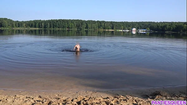 Naked girl goes skinny dipping in public beach