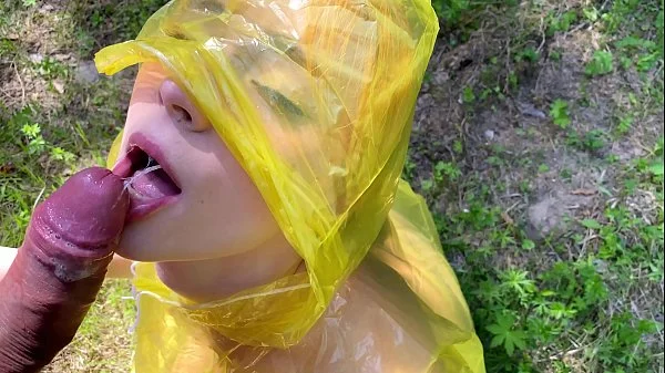 b. in pvc raincoat sucks an swallow dick