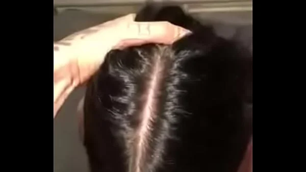 Submissive brunette sucking a giant cock