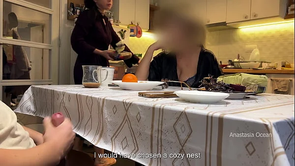 My husband jerking under a table front of my step mom and i right at the kitchen.