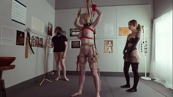 Submissive bondage puppet Rebel Rhyder sucks cock and eats ass in a demented threesome game