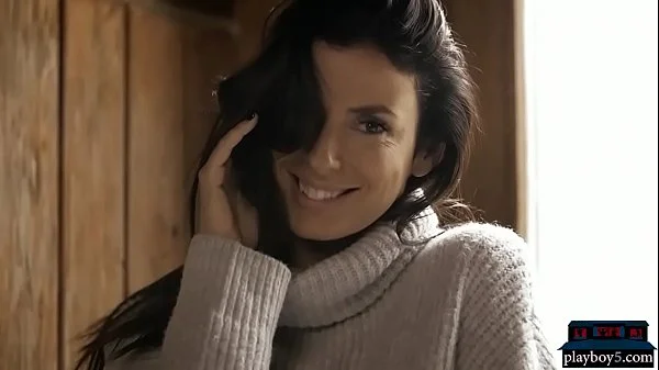 Perfect brunette babe gives a striptease and poses