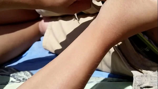 Girl Masturbates boyfriend on a public beach