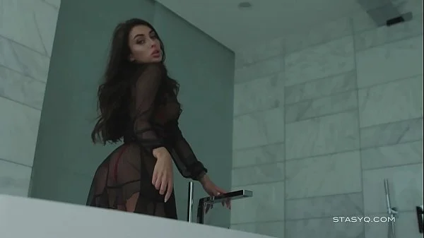 Busty russian babe Megan teasing from the bathtub