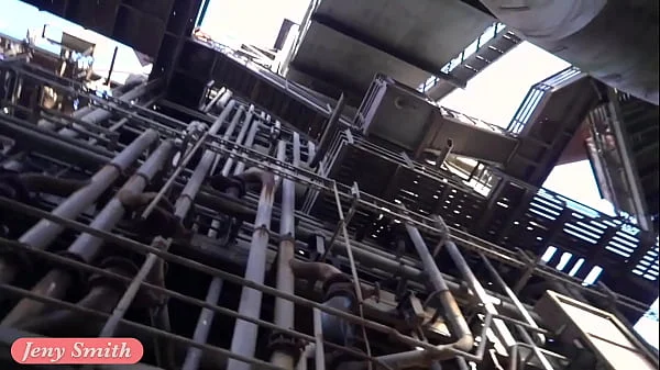 Jeny Smith is walking naked through an abandoned factory.