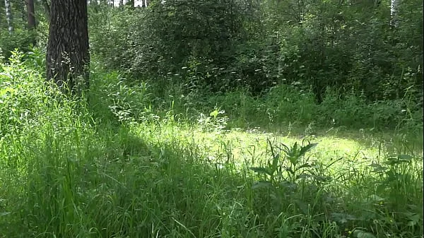 Voyeur outdoors peeps at two naked lesbians. Nudists with big asses sunbathe and enjoy nature and masturbation.