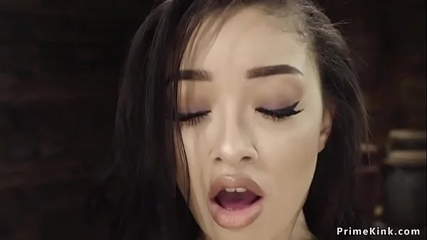 Slim babe strips and fucks machine