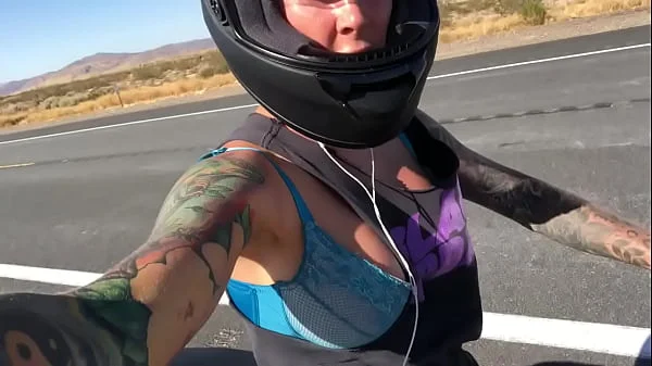 felicity feline riding on aprilia tuono motorcycle