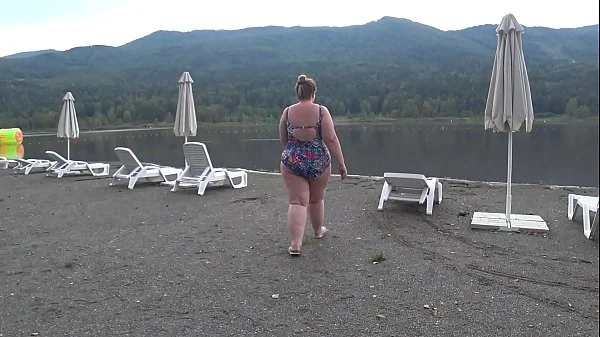 BBW with big booty in tight jeans is dressing in a public dressing room on the beach. Fetish.