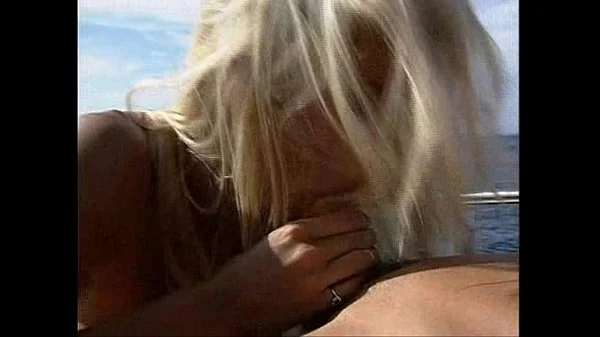 Busty lifeguard having fun on a boat.