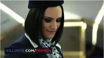 The Air Hostess Claire Castel Takes A Good Care Of A Passenger