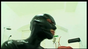 Humiliating pussy distress dildo sucking in masked, dominantrice in red latex dress