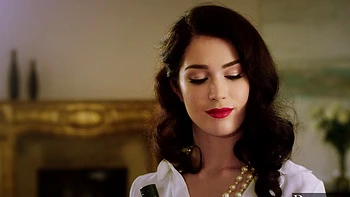 Two guys share a hot brunette in an intense threesome scene.