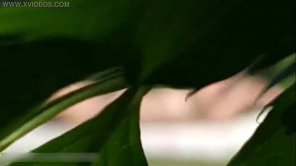 A NEIGHBOR SPIES ON A NAKED BIG-BOOBED NUDIST WOMAN