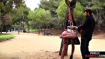 Cute bonded babe dominated outside