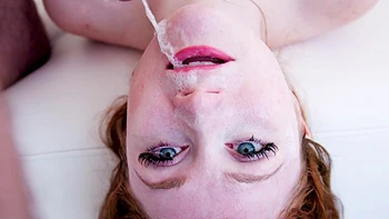 Redhead Scarlet Skies enjoys intimate moments with her partner.