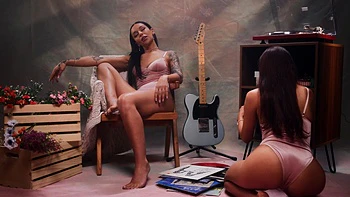 Two cute girls, Vanna Bardot and April Olsen, have fun on the bed with toys.