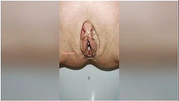 Beautiful Bald Pussy Of Petite Milf Makes The Big Powerful Urine Fountain Close Up
