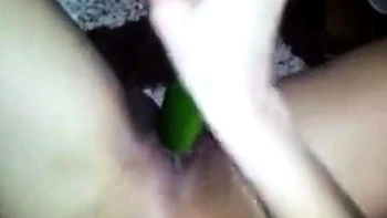 Asian Girl's Solo Fun with a Cucumber