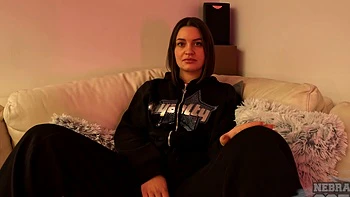 A cute brunette named Paulina plays with her pussy in the bra