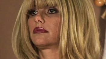 Lady in a purple corset Penny Porsche plays with her lovely dildo