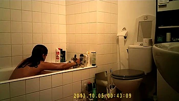 Brunette uses the toilet and takes a shower