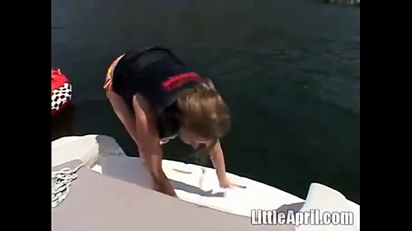 Sexy teen Little April playing with her snatch outdoors in rubber boat