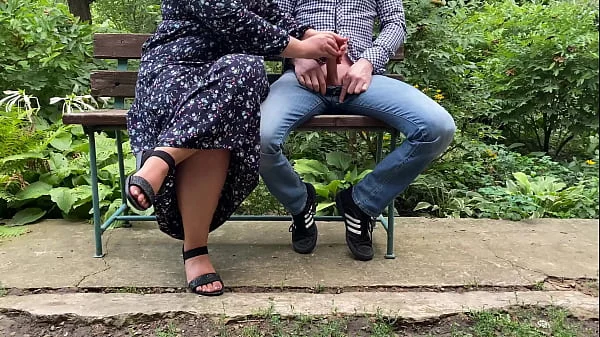 Handjob outdoors in the park