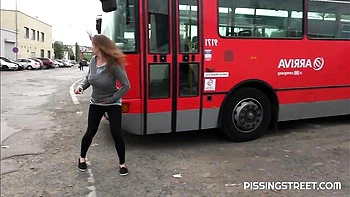 Crazy solo pissing on the pave with a hot short-haired girlfriend Suzie